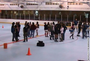 Skaters and others on the floor at the Castle Sports Club as the bout is cancelled due to a leaky roof.
